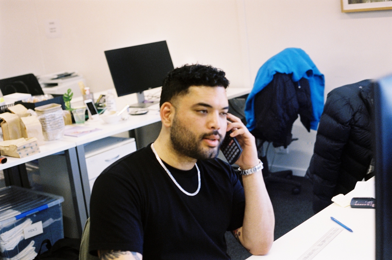 Harris on the phone at Ecoware HQ