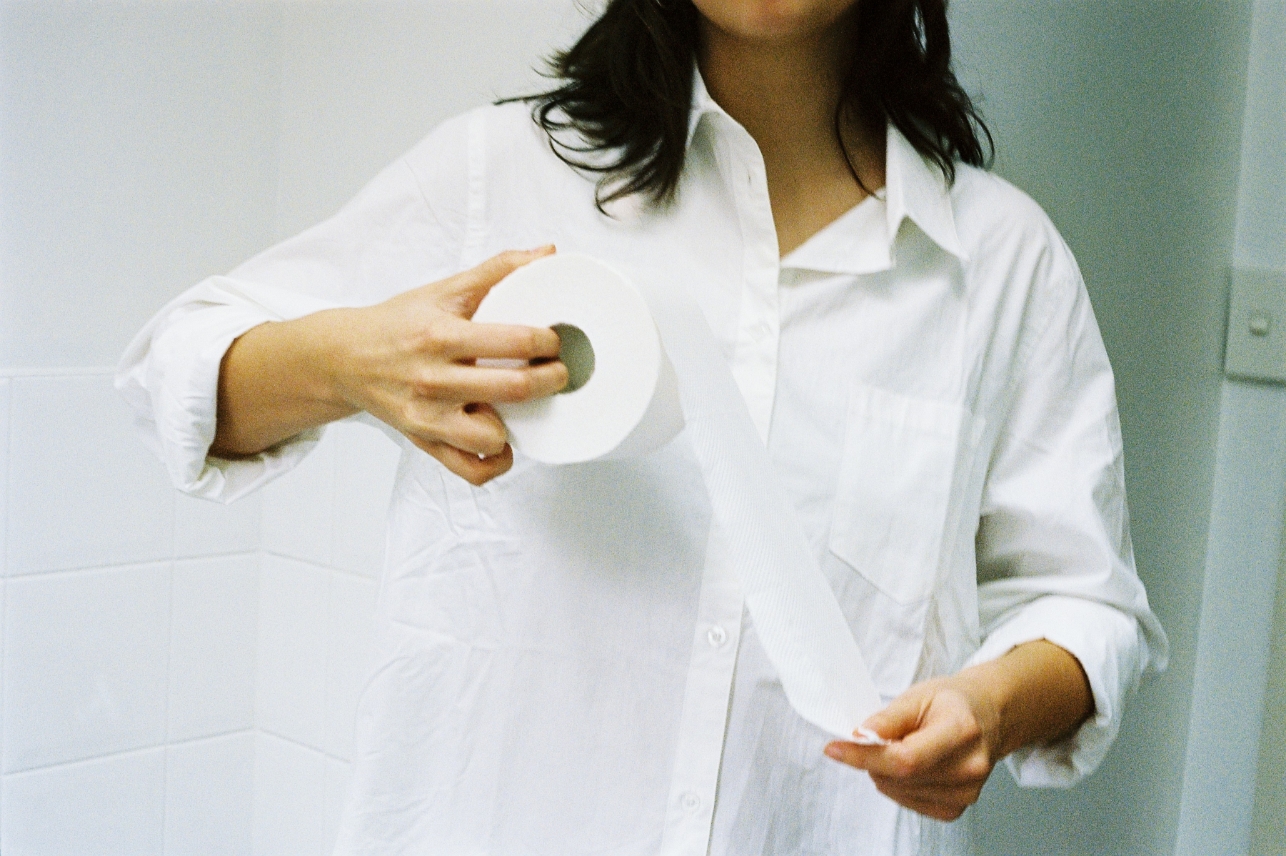 Eden holding a roll of EcoRoll toilet paper