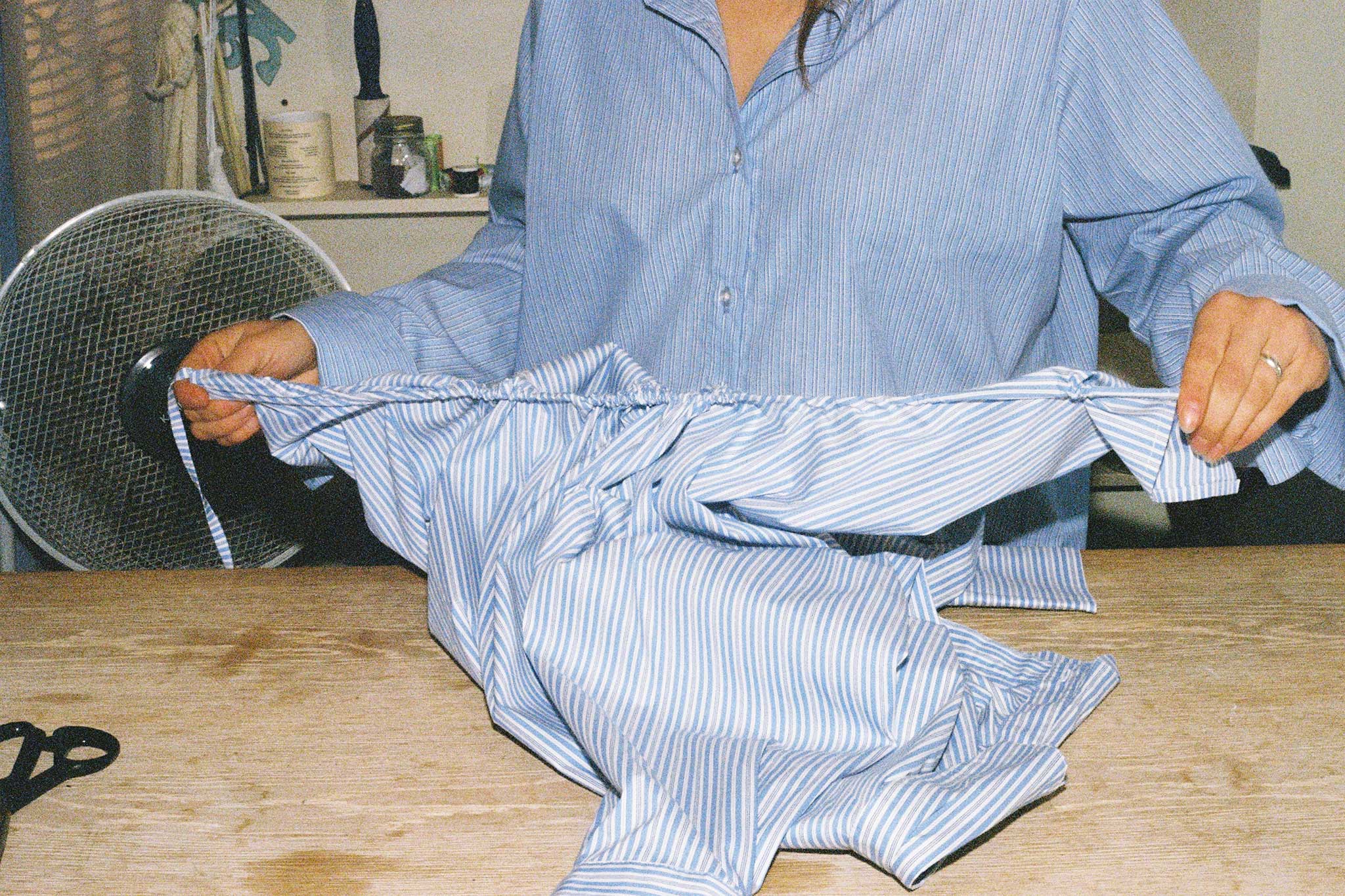 Brand content for Common. Collaboration with designer Joelle Ruck of riel in her studio on 35mm film. Joelle re-works fashion waste into covetable pieces. This is her curve shirt.