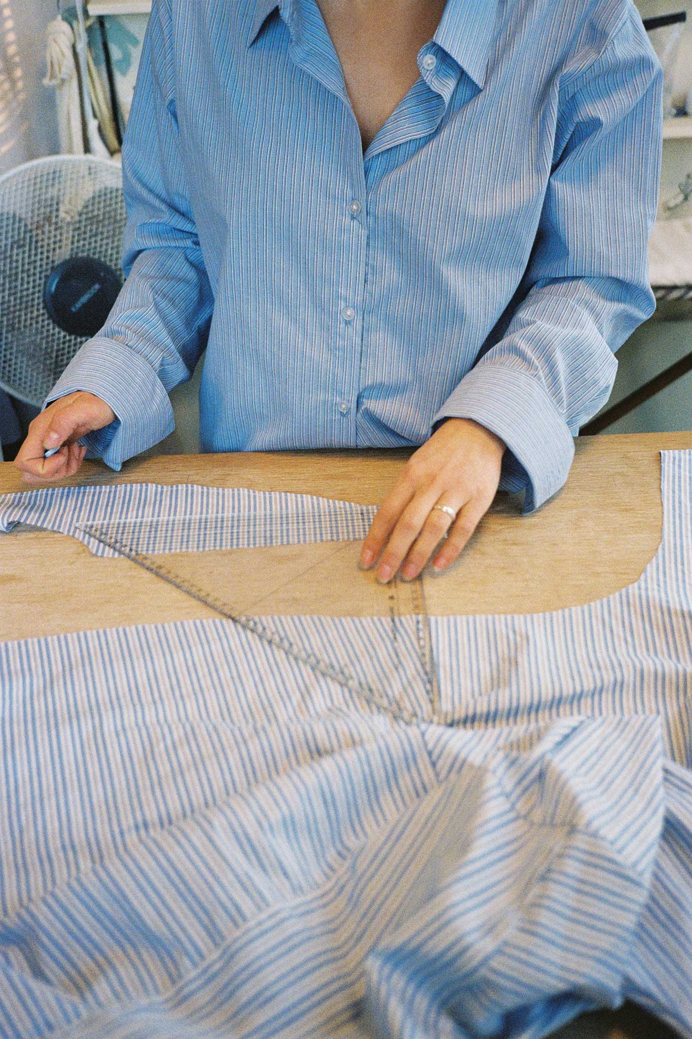 Brand content for Common. Collaboration with designer Joelle Ruck of riel in her studio on 35mm film. Joelle re-works fashion waste into covetable pieces. This is her curve shirt.