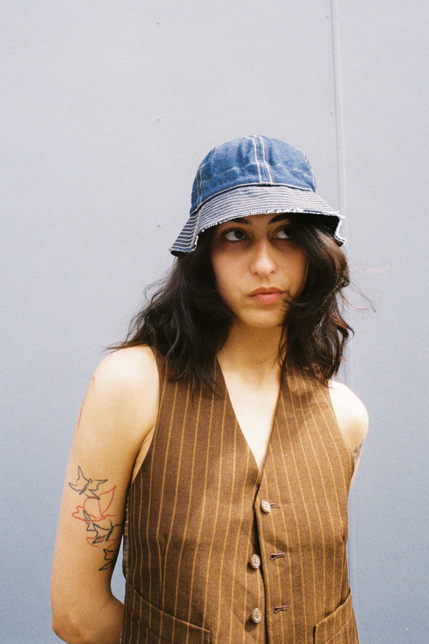 Bella wearing a Common x Ratbags re-worked denim hat. Film fashion photography for Common.