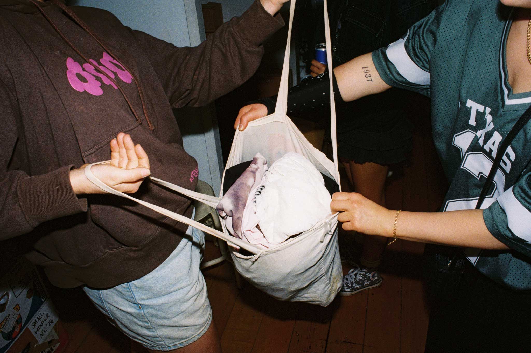 Photograph of secondhand clothing haul. Social media content photography on 35mm film for Common.