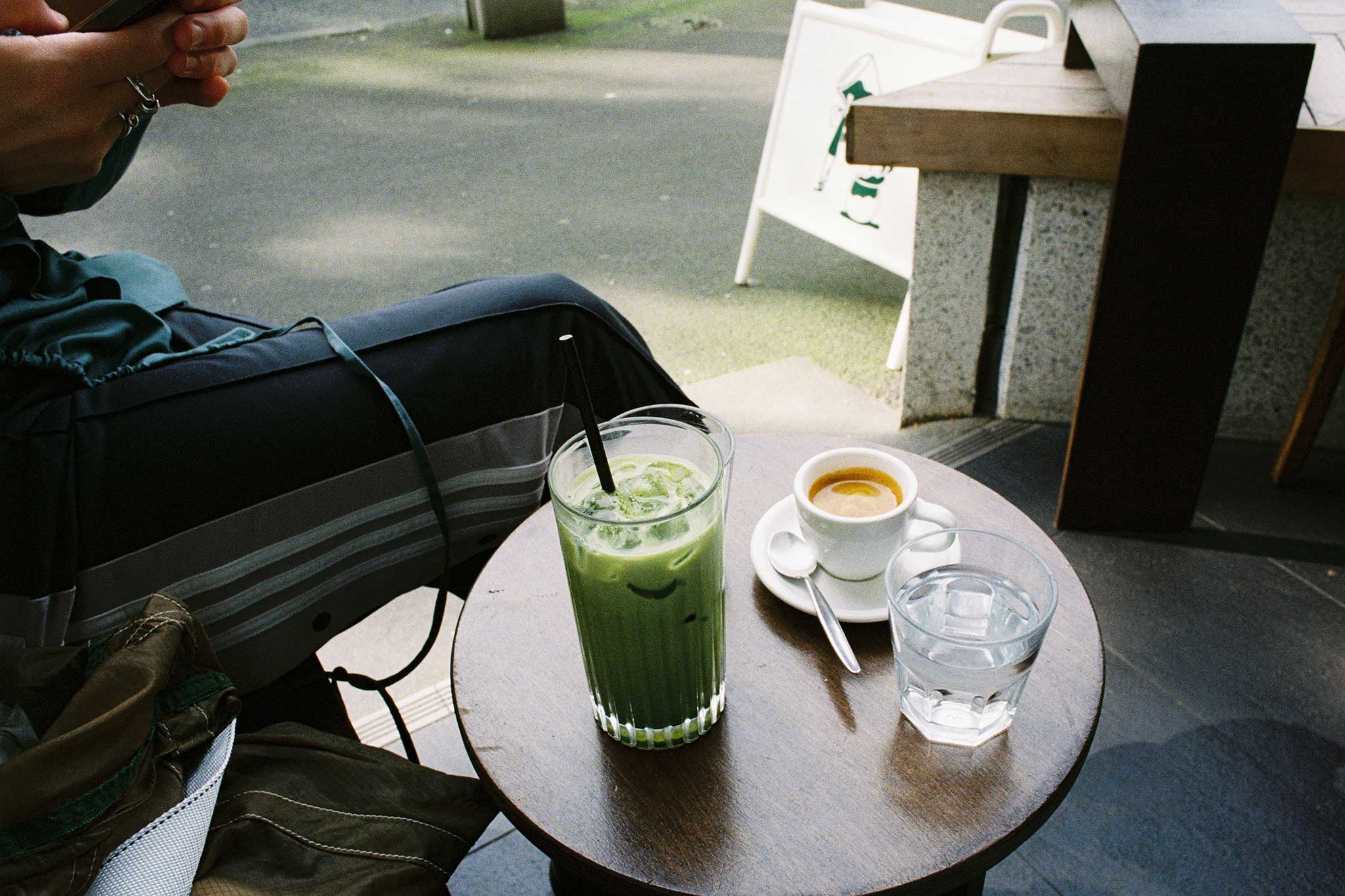 Café photography ideas. Matcha and espresso at Kompass Coffee, a specialty coffee shop, photographed on 35mm Kodak Ultramax film.
