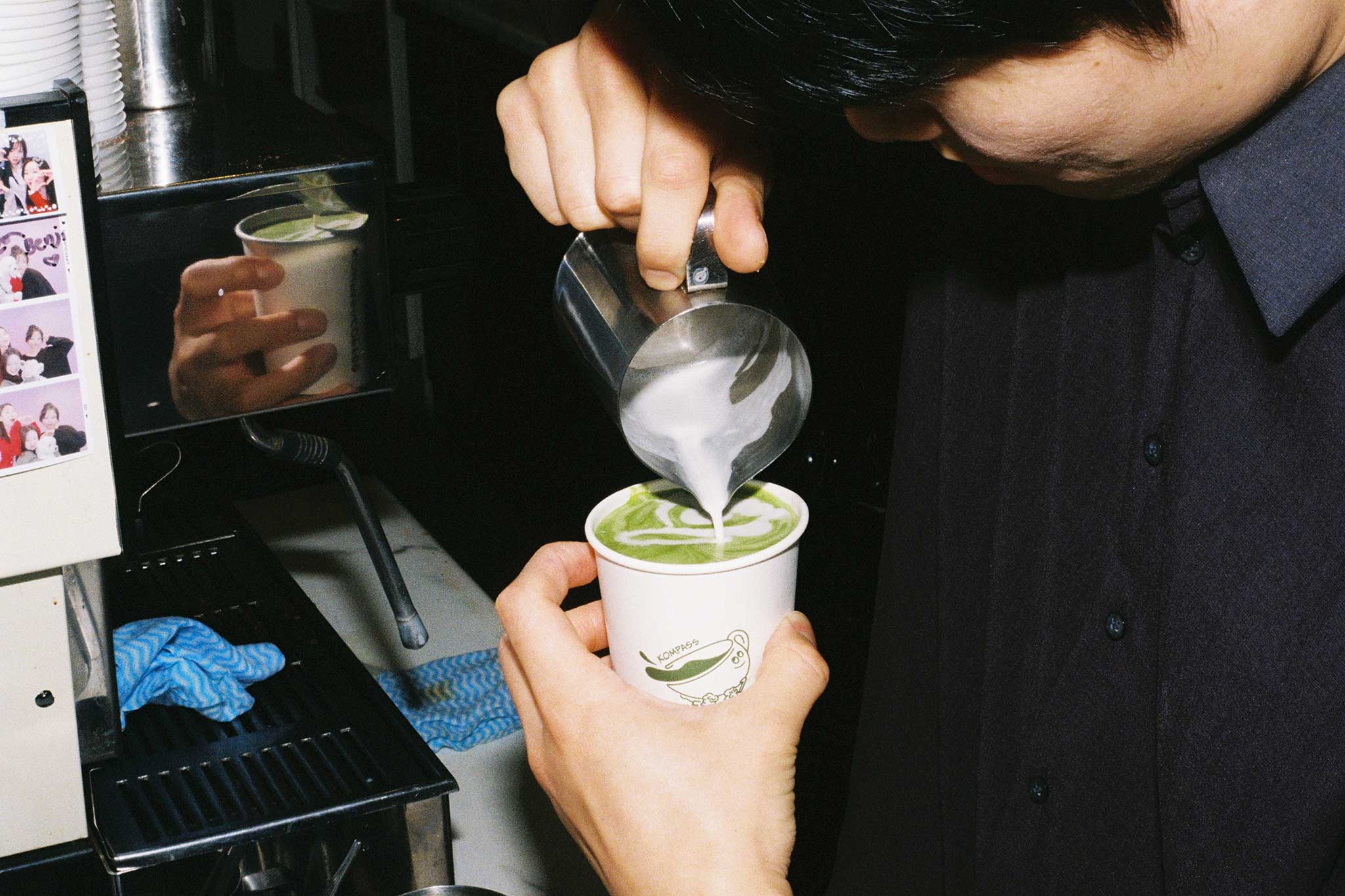 Barista creating latte art for takeaway matcha photographed on 35mm film. Social media content ideas for cafés and restaurants.