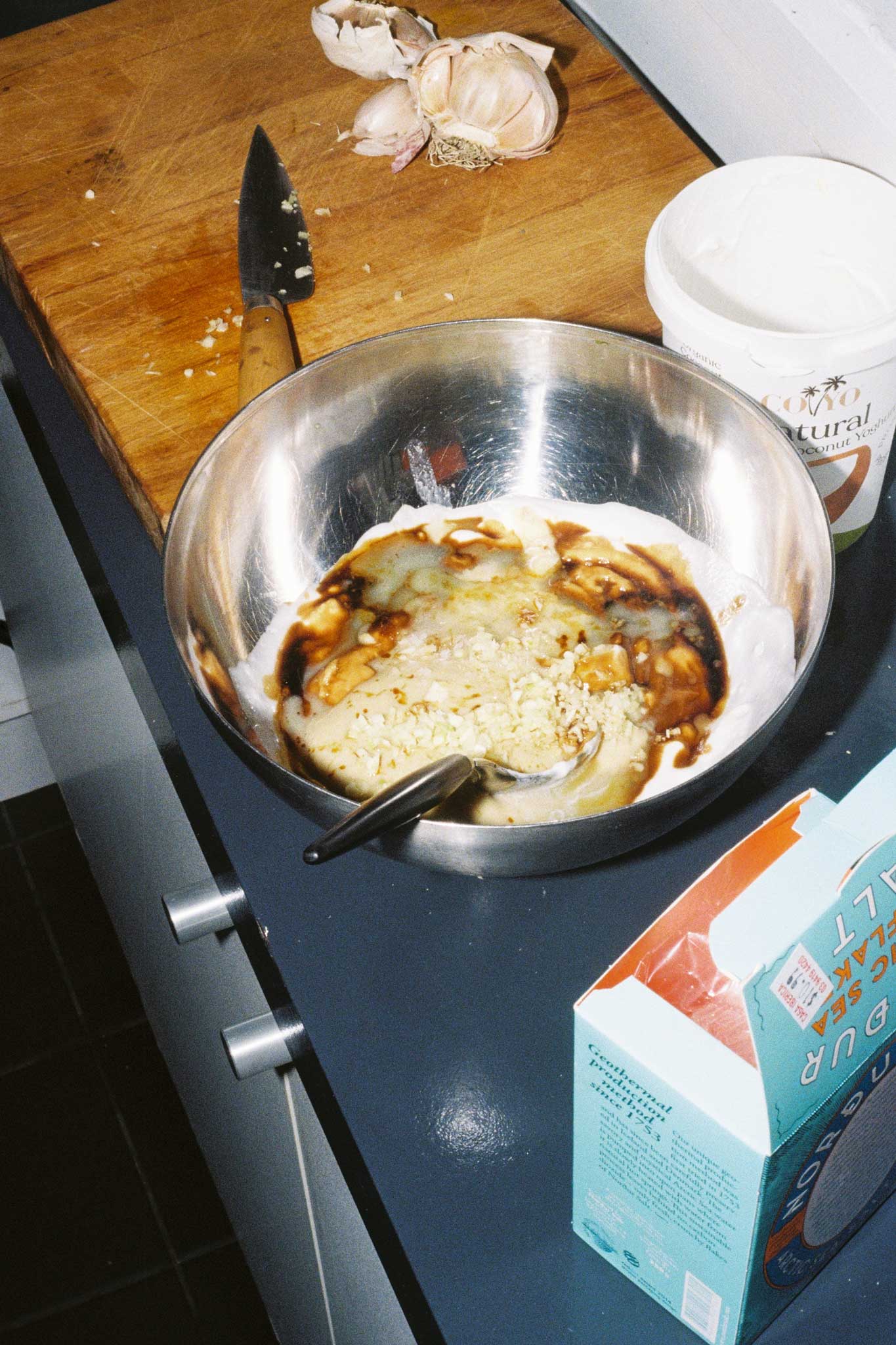 Cooking at home, photographed on film with direct flash using Kodak Ultramax 35mm film. Social content photography for food brands.